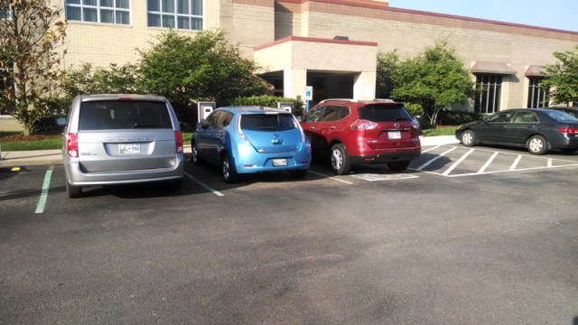 Mini Van blocks the way. The red mini van is disabled in a disabled spot. Gave him a pass.